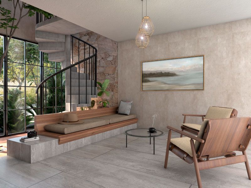 Sala con banca corrida de madera, sillones y escalera de caracol junto al muro de piedra