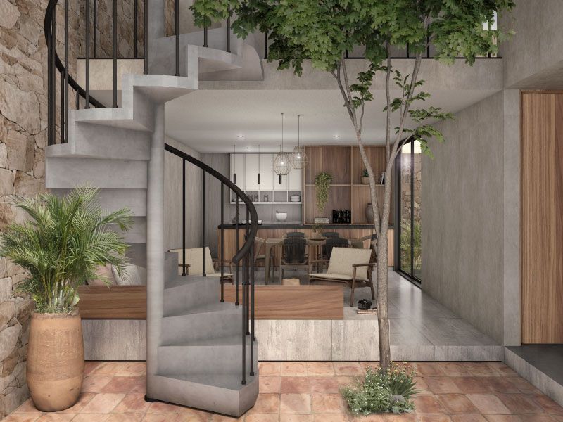 Doble altura con escalera de caracol, árbol interior y cocina-comedor al fondo