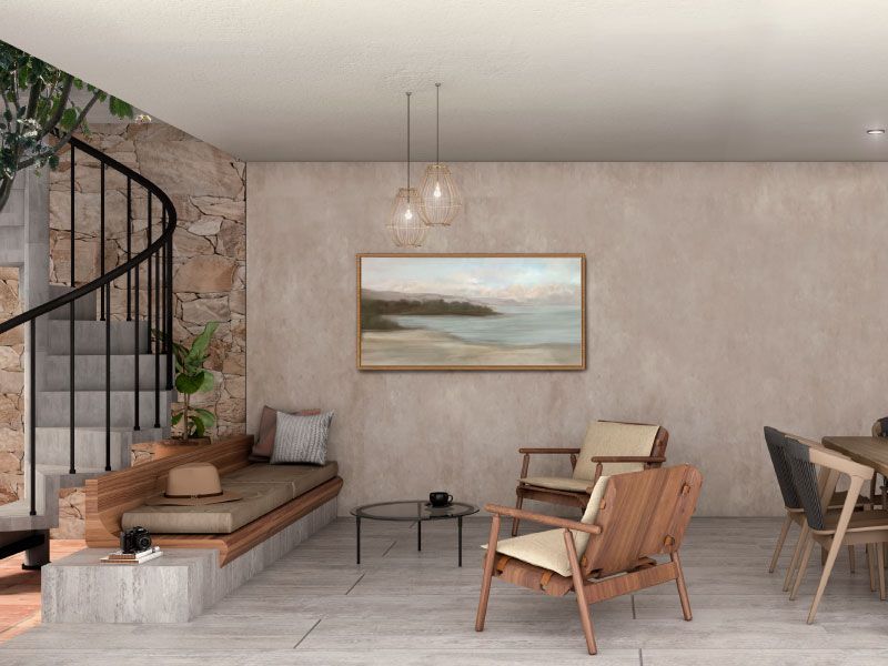 Estancia con sillones de madera, banca corrida y comedor junto a la escalera de caracol